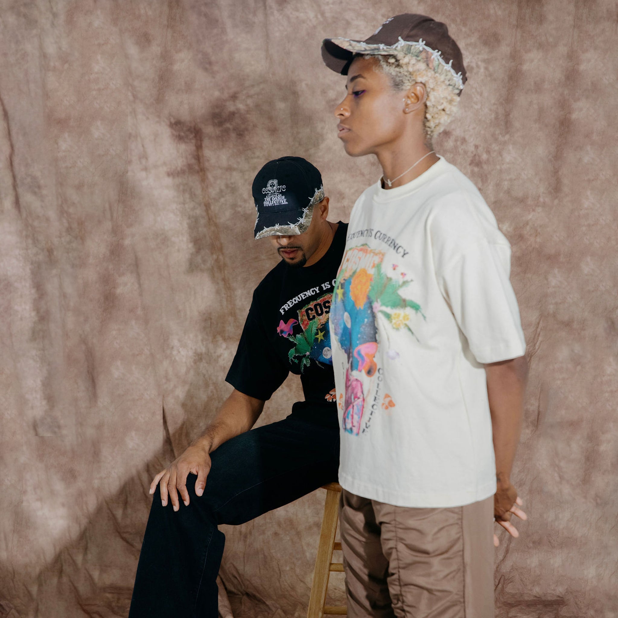 Cosmic the Oasis offers a 100% cotton t-shirt with printed Miami Pop Up graphics on front and back, available in black and champagne. Standard sizing. All cotton tees should always be washed in cold water, with delicate or line dry.