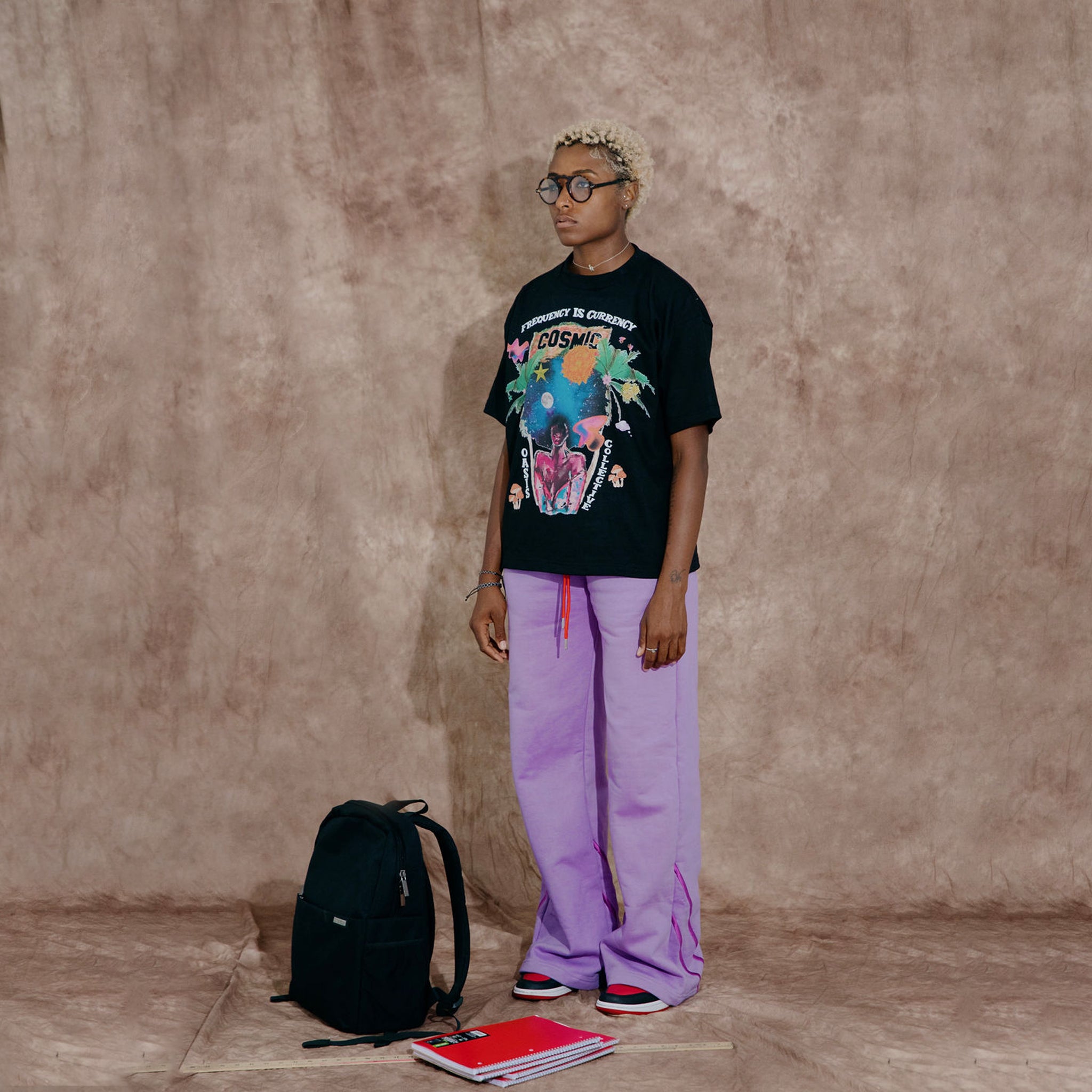Cosmic the Oasis offers a 100% cotton t-shirt with printed Miami Pop Up graphics on front and back, available in black and champagne. Standard sizing. All cotton tees should always be washed in cold water, with delicate or line dry.