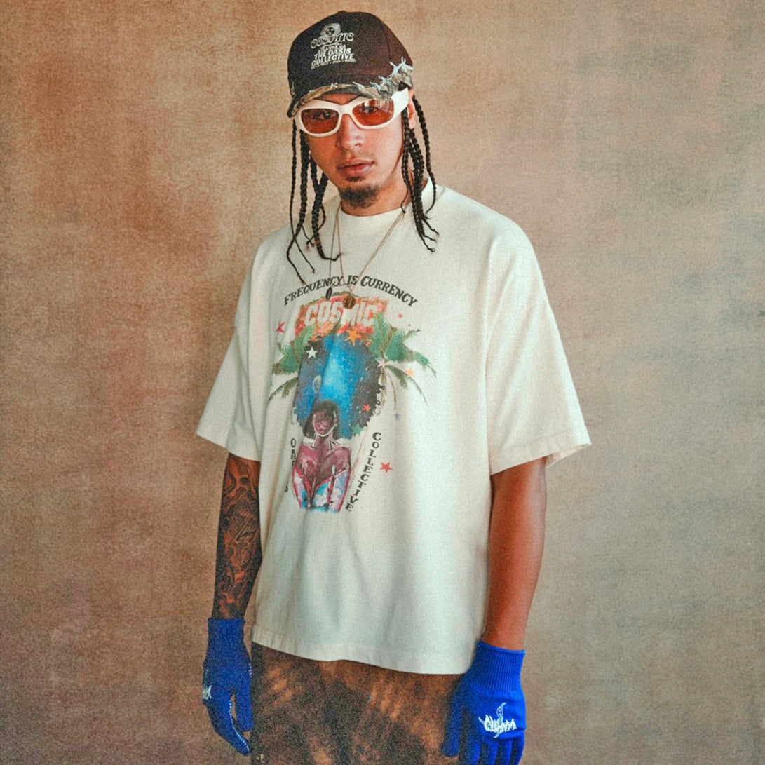 Cosmic the Oasis offers a 100% cotton t-shirt with printed Miami Pop Up graphics on front and back, available in black and champagne. Standard sizing. All cotton tees should always be washed in cold water, with delicate or line dry.