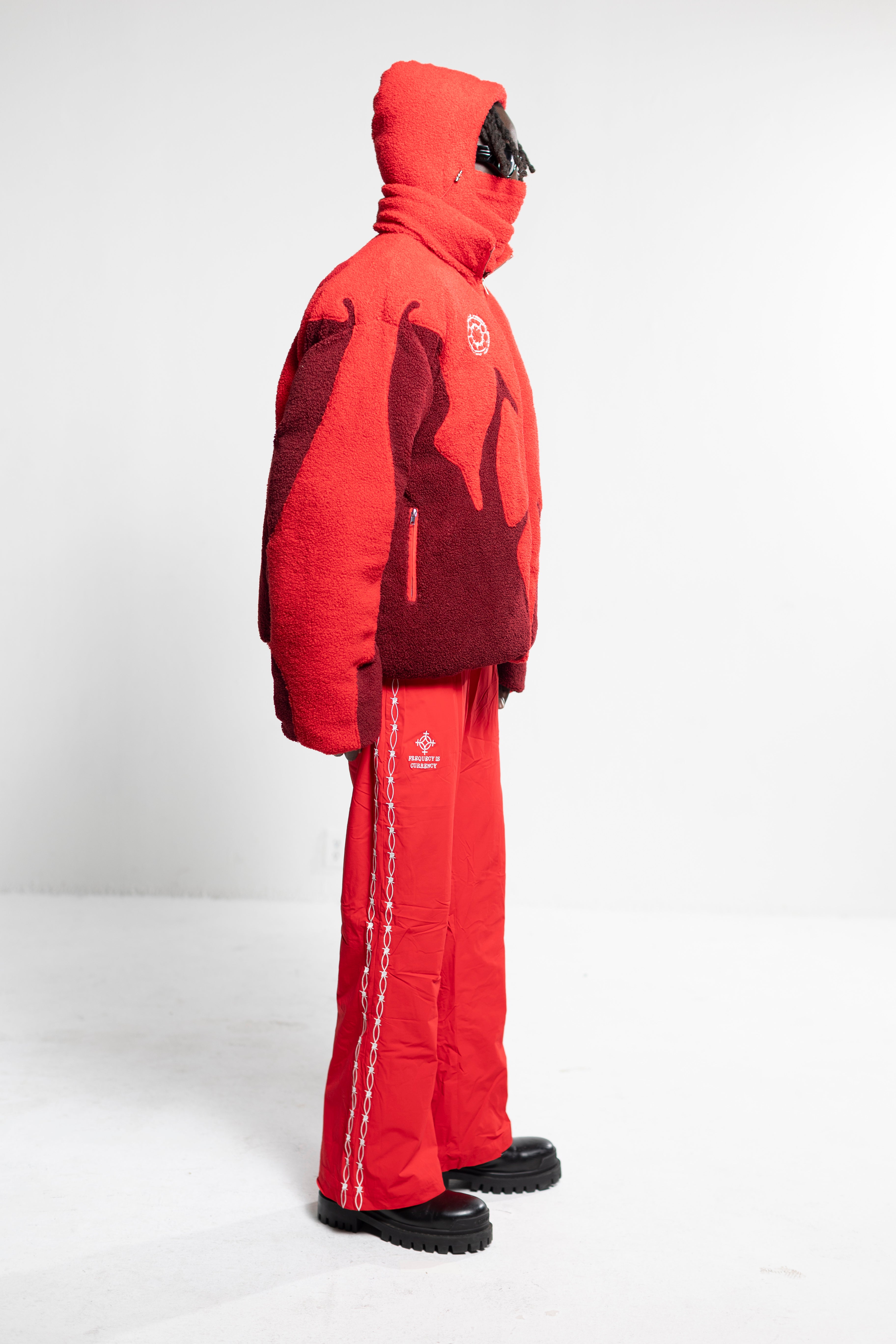 Red snowsuit with a hood on a white background