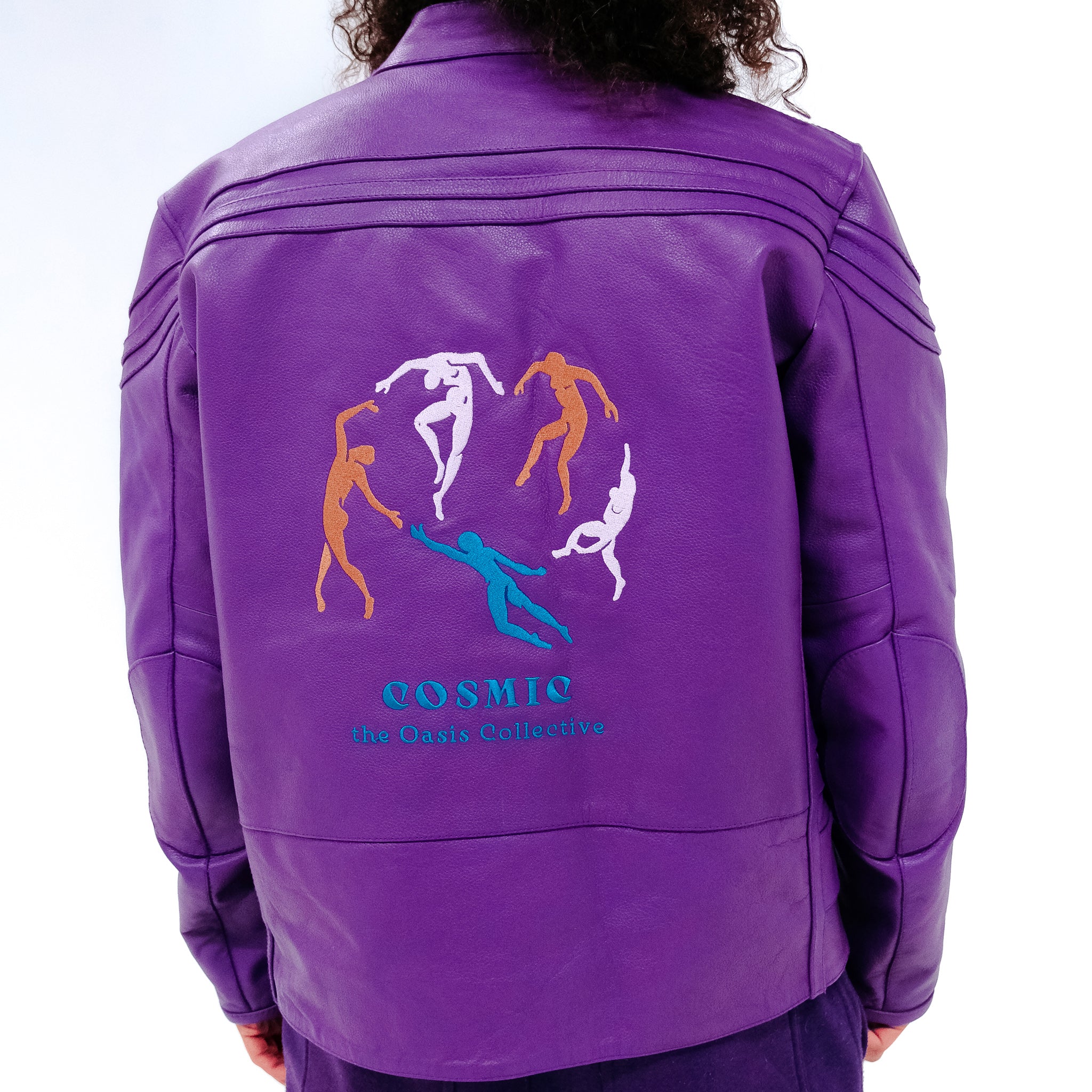 Cosmic the Oasis purple leather jacket is a 1 of 1 prototype with side pockets and detailed embroidery on the back.  Fits Large Men